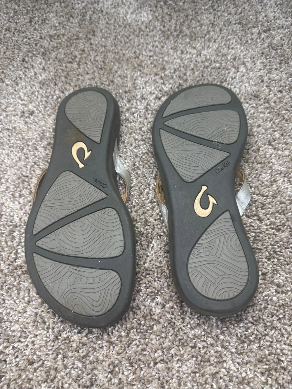 OluKai Gold and Black Women's Toe-Post Sandals